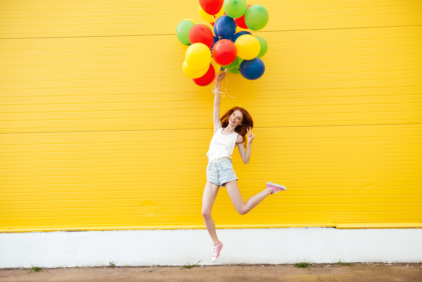 Woman Jumping with Balloons